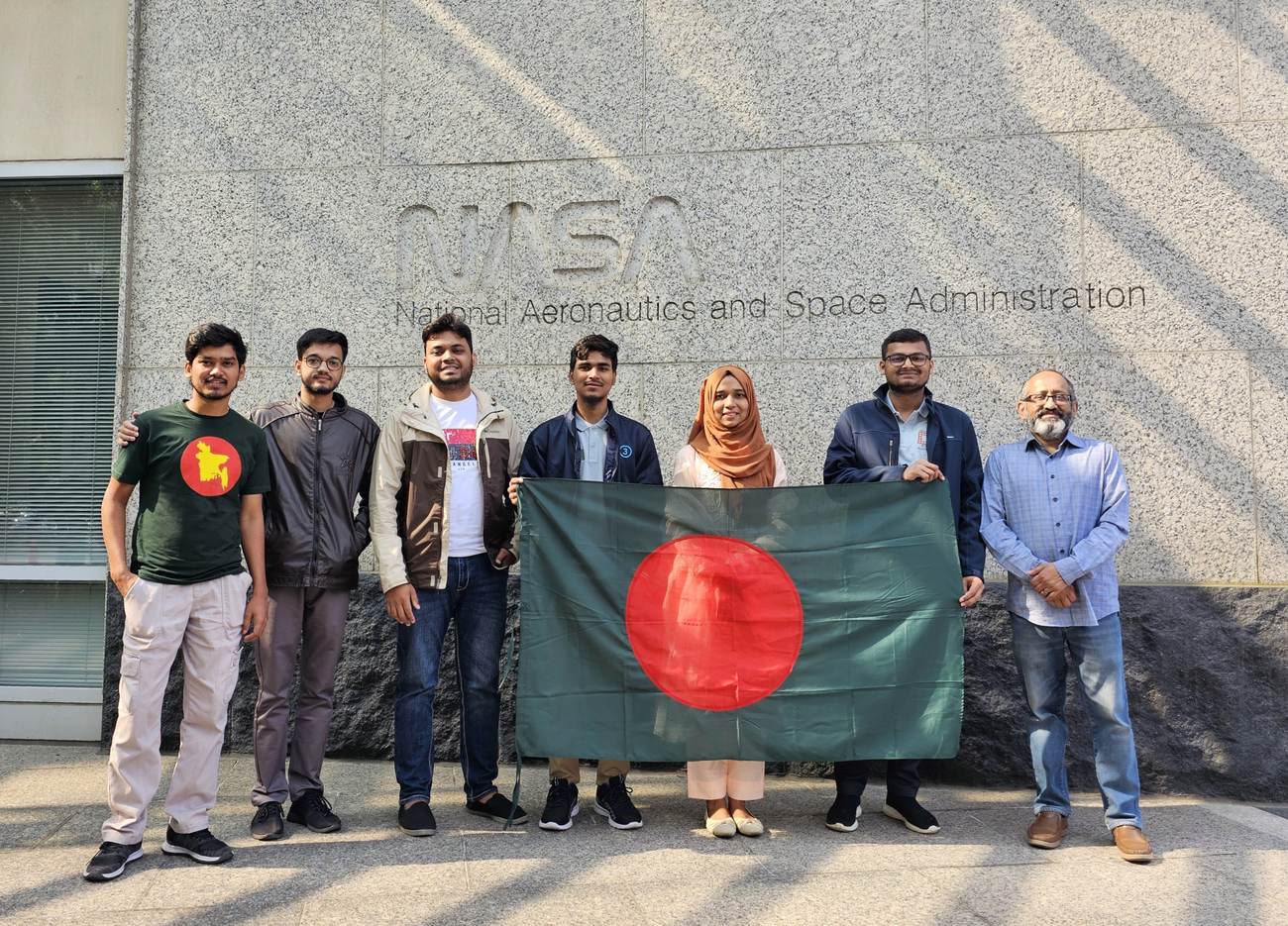With the flag of Bangladesh at NASA Headquarters